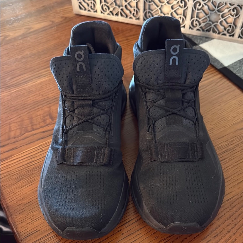 On Running Black Athletic Shoes with Breathable Mesh and Cushioned Sole